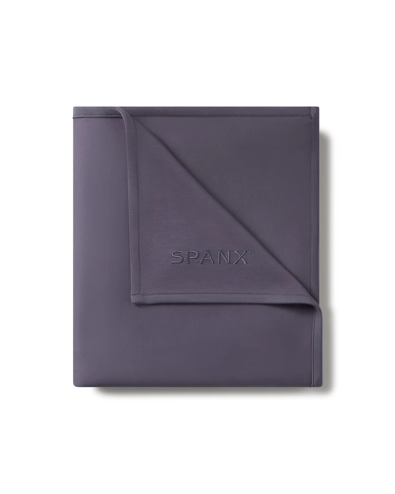 Folded SPANX AirEssentials Blanket in Storm