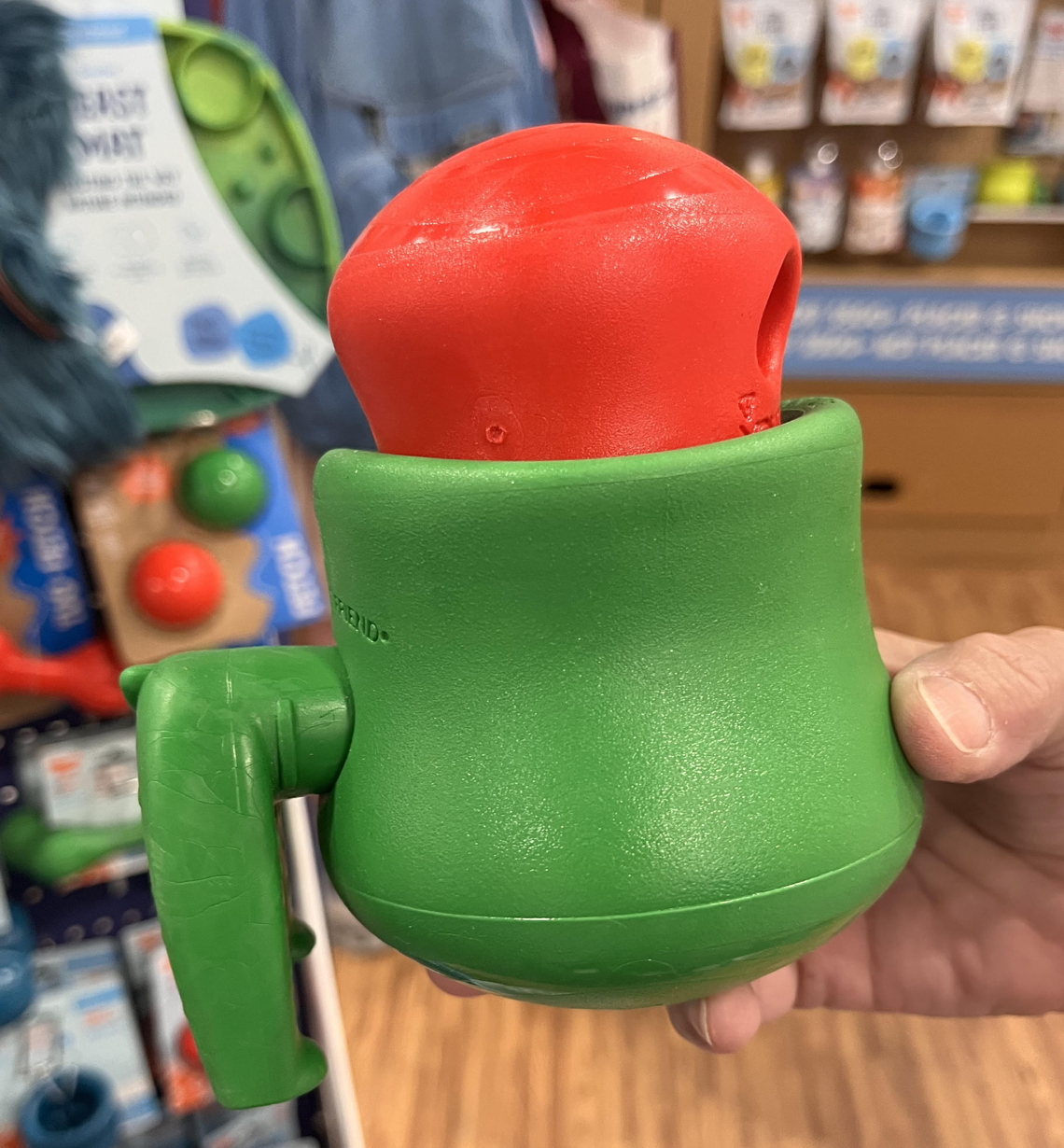 A green TOPPL with its smaller red component, held for a close look.