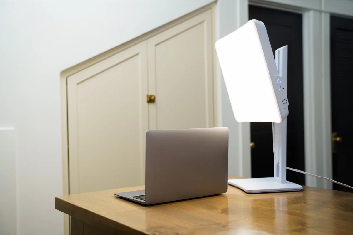 White Carex Day-Light Elite light therapy lamp on its adjustable stand