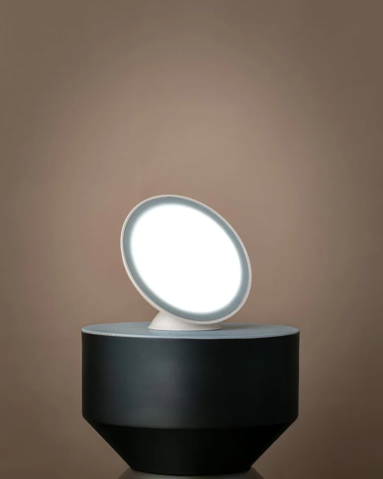 White round Circadian Optics Lampu light therapy desk lamp