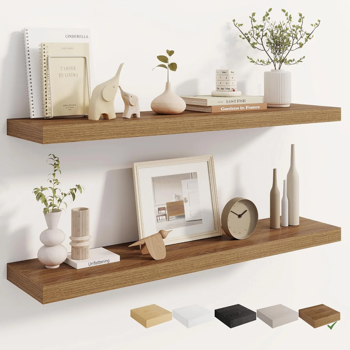 Two long walnut-finish Dreamland floating shelves styled with books, plants, and decorative objects