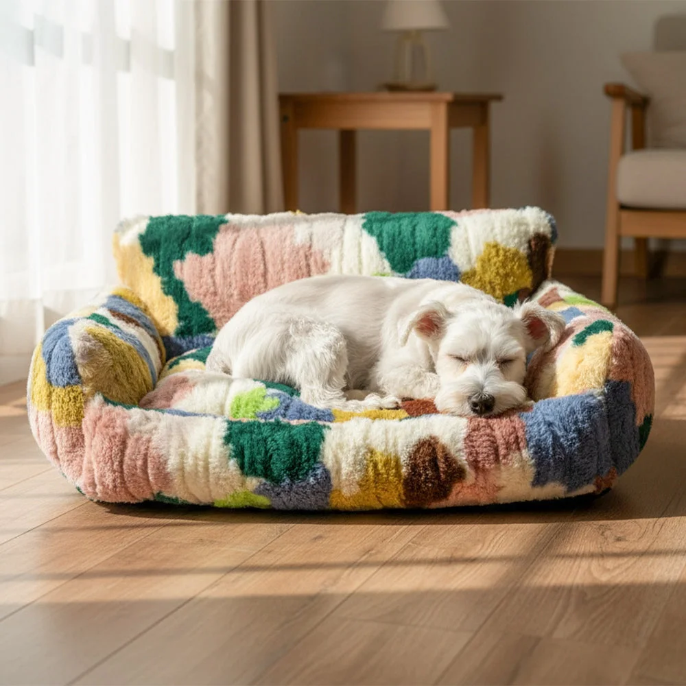 Small white dog sleeping in the colorful Moss Bloom PawLoom CozyPatch Plush Pet Sofa Bed