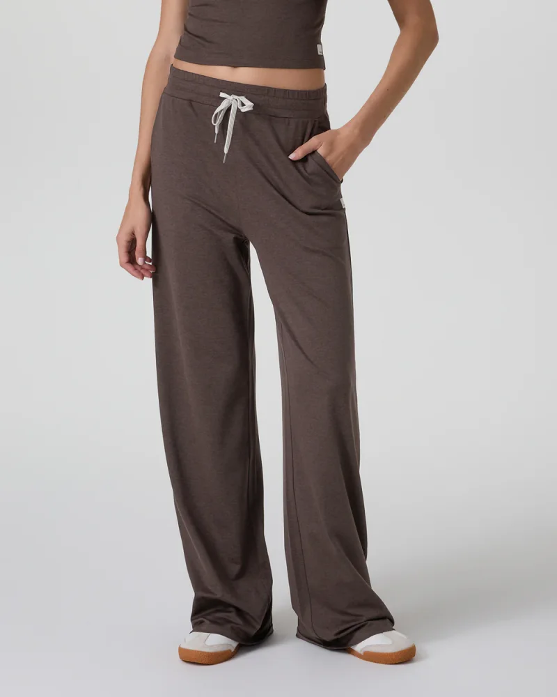 Woman wearing Vuori Halo Essential Wideleg Pants in Java Heather