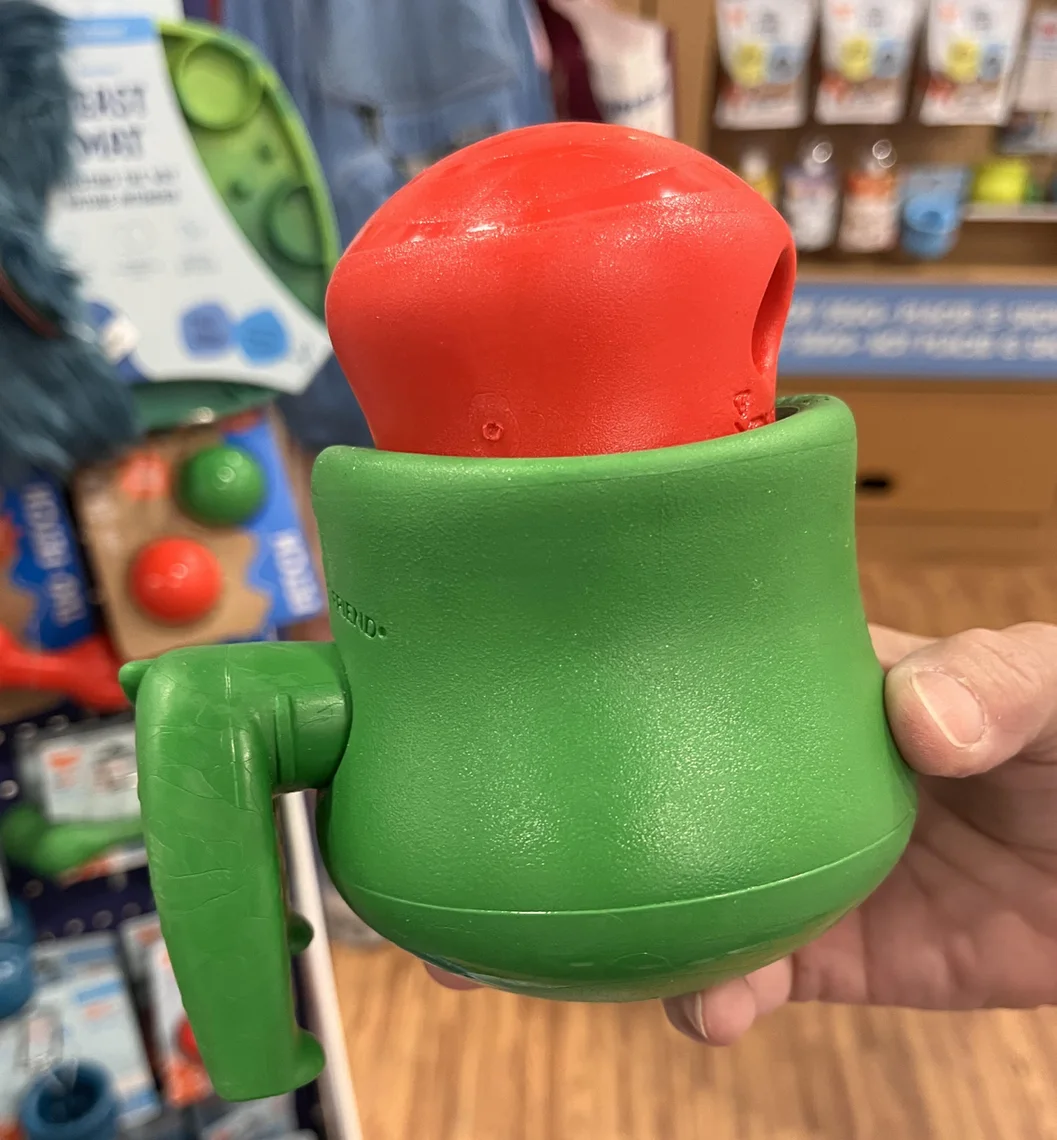 A green TOPPL with its smaller red component, held for a close look.