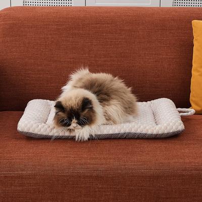 Long-haired cat resting on the cream Petpals CoolNest gel cooling pillow bed